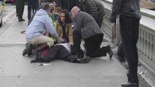 Injured people are assisted after an incident on Westminster Bridge in London, March 22, 2017. REUTERS/Toby Melville